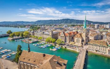 Aerial,View,Of,Historic,Zurich,City,Center,With,Famous,Fraumunster